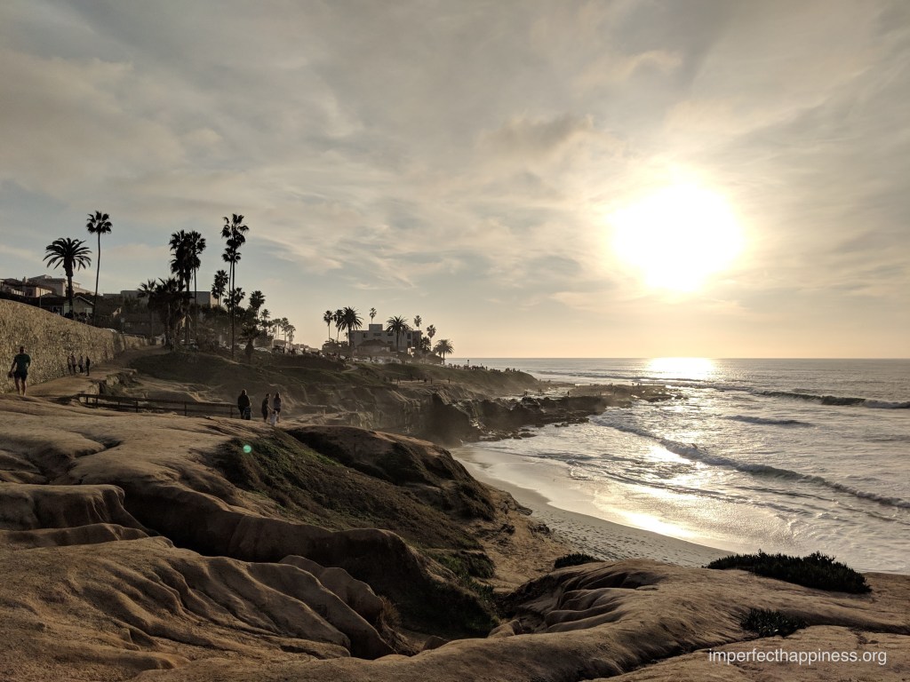 sunset over ocean and cliffs